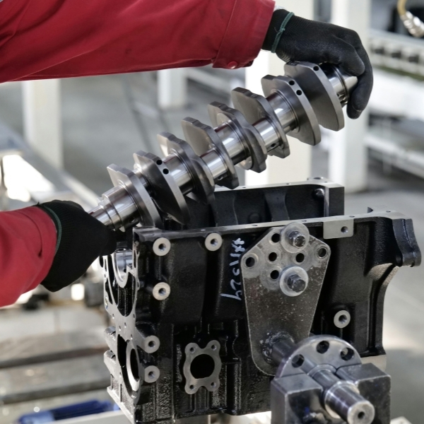 Tech working on a machined part