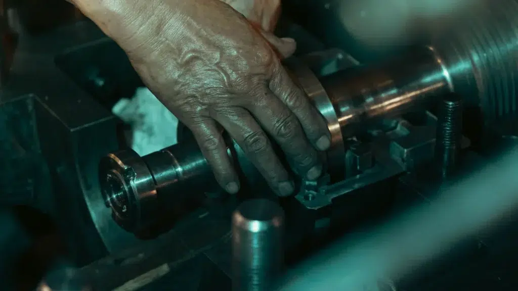 Trained millwright machining on a metal lathe